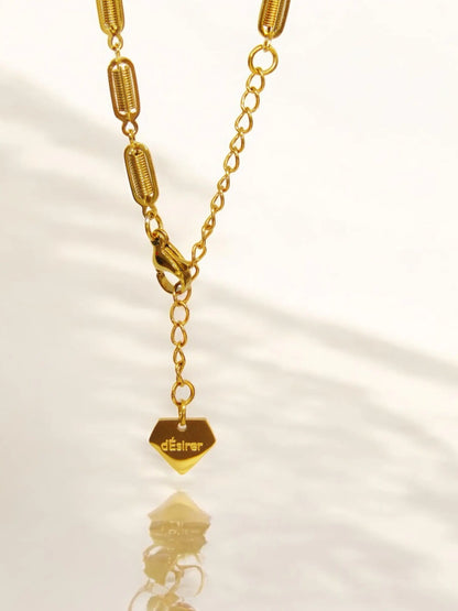 Elongated, oval gold bracelet links dÉsirer dÉsirer
